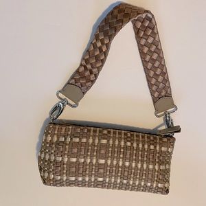 The SAK brown and cream colored crocheted bag